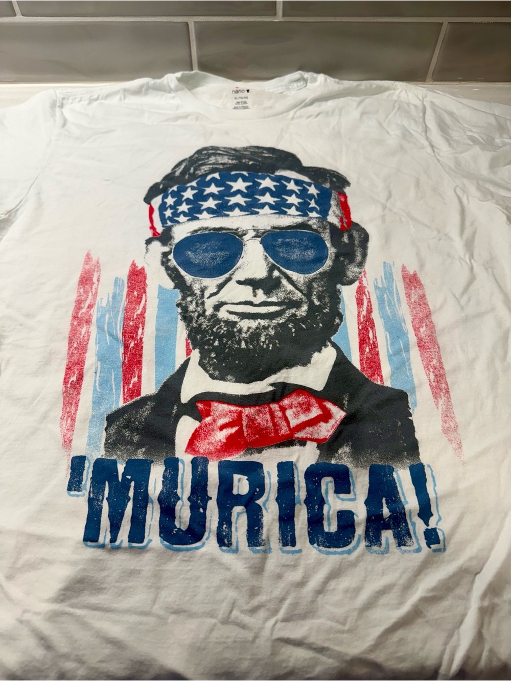 White Patriotic Graphic Tee with Cool Abraham Lincoln in Sunglasses. ‘Amurica